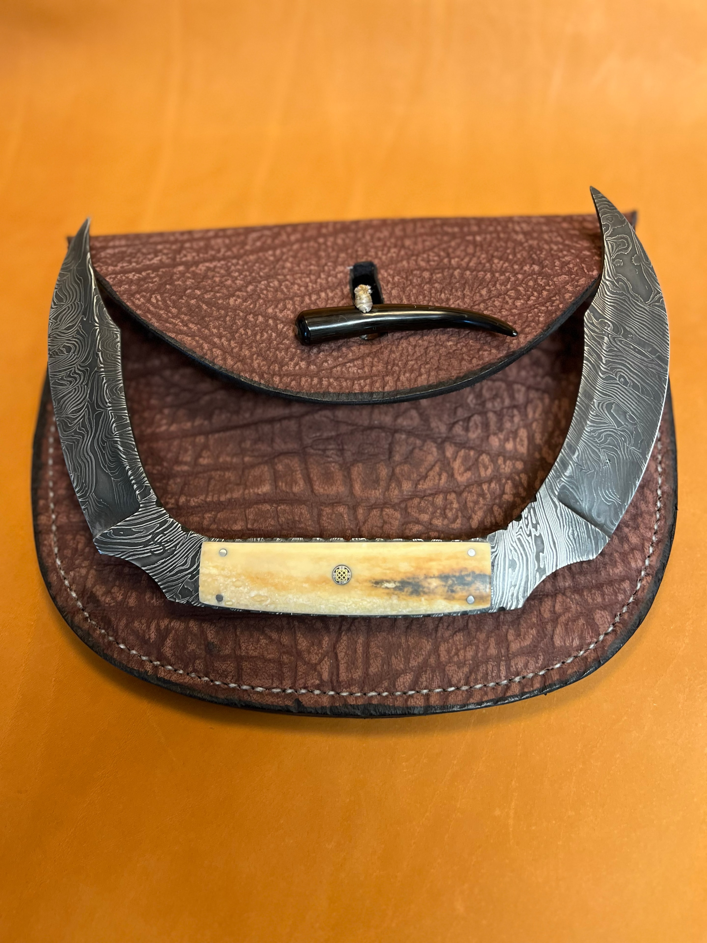 Demon Chaser — Damascus folding knife with leather case