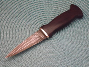 Forged blade — edge view